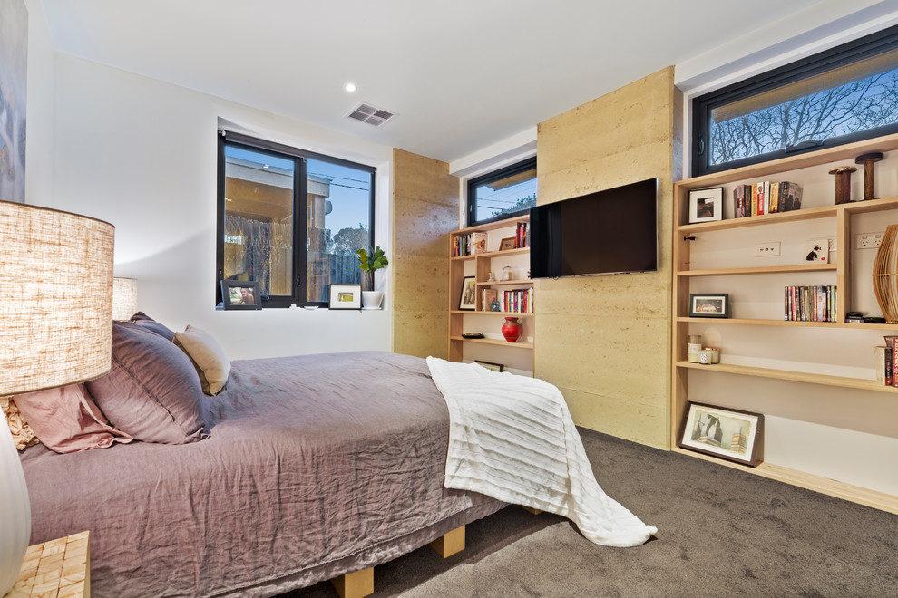 Design ideas for a mid-sized contemporary master bedroom in Melbourne with multi-coloured walls, carpet, no fireplace and black floor.