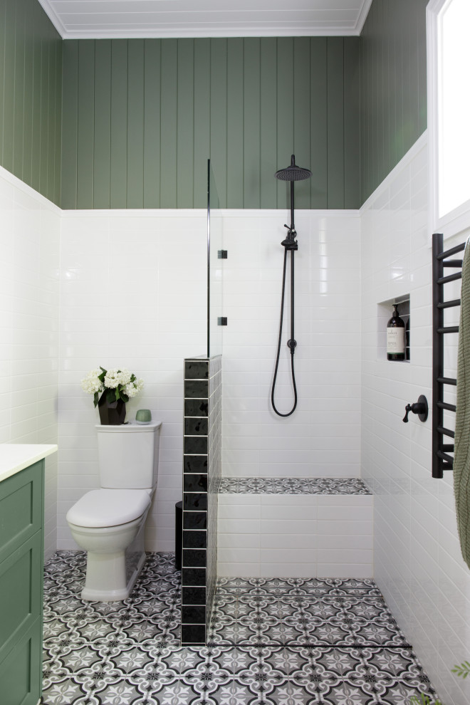 Design ideas for a mid-sized traditional master bathroom in Brisbane with shaker cabinets, green cabinets, an open shower, white tile, ceramic tile, green walls, ceramic floors, engineered quartz benchtops, grey floor, an open shower, white benchtops, a shower seat, a single vanity, a floating vanity and panelled walls.