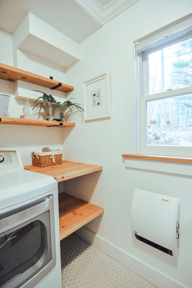 Photo of a small contemporary galley utility room with an undermount sink, open cabinets, medium wood cabinets, wood benchtops, white walls, porcelain floors, a side-by-side washer and dryer and grey floor.