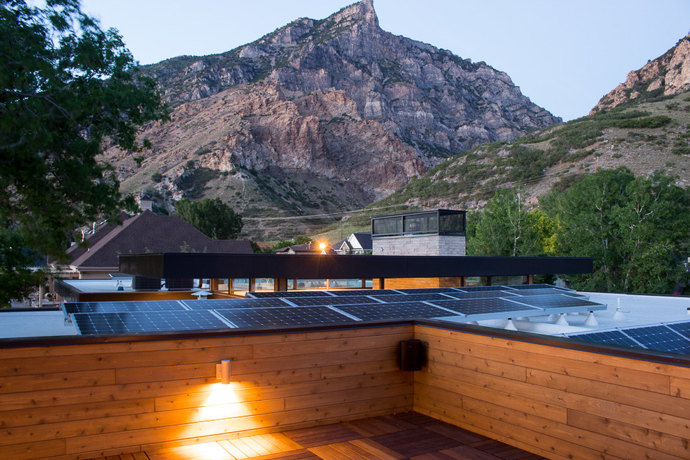 This is an example of a mid-sized modern rooftop deck in Salt Lake City with no cover.