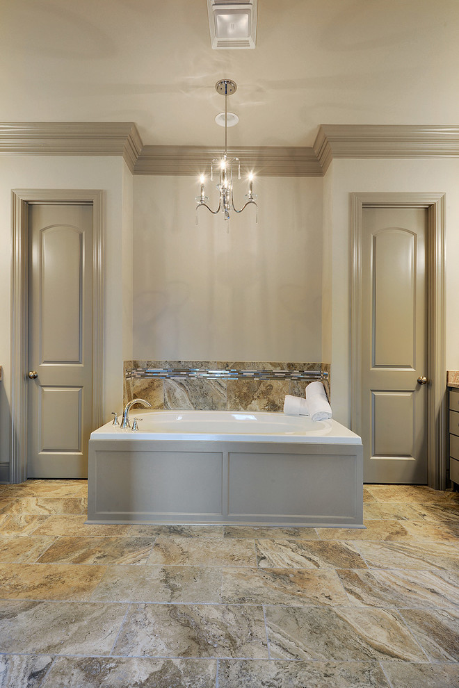 Photo of a mid-sized traditional master bathroom in New Orleans with an undermount sink, furniture-like cabinets, grey cabinets, granite benchtops, an alcove tub, a double shower, a two-piece toilet, multi-coloured tile, ceramic tile, grey walls and ceramic floors.