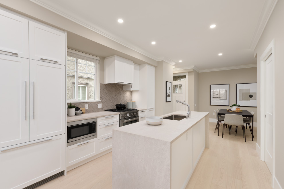 Example of a transitional kitchen design in Vancouver