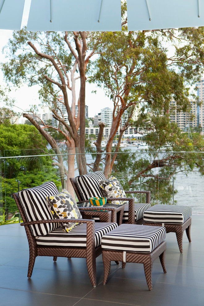 This is an example of a contemporary patio in Brisbane with tile.