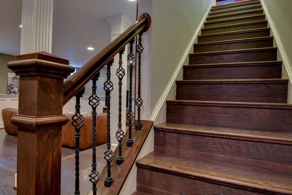 Basement - huge transitional walk-out dark wood floor and brown floor basement idea in DC Metro with green walls and no fireplace