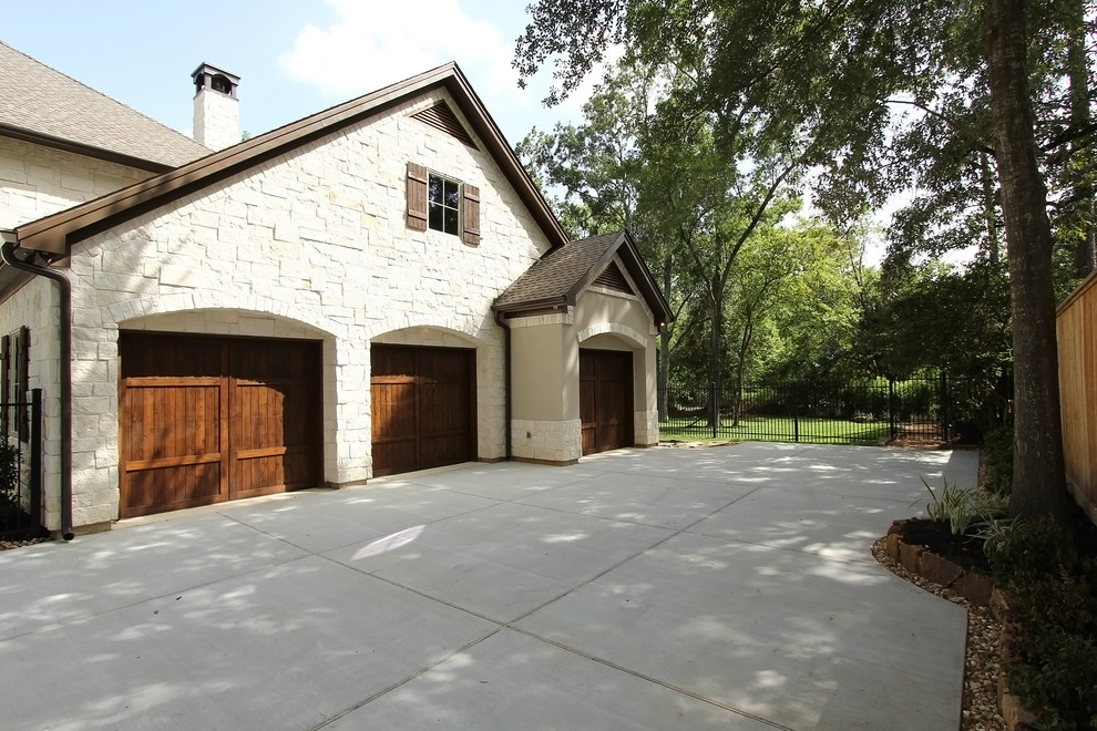 Design ideas for a transitional attached three-car garage in Houston.