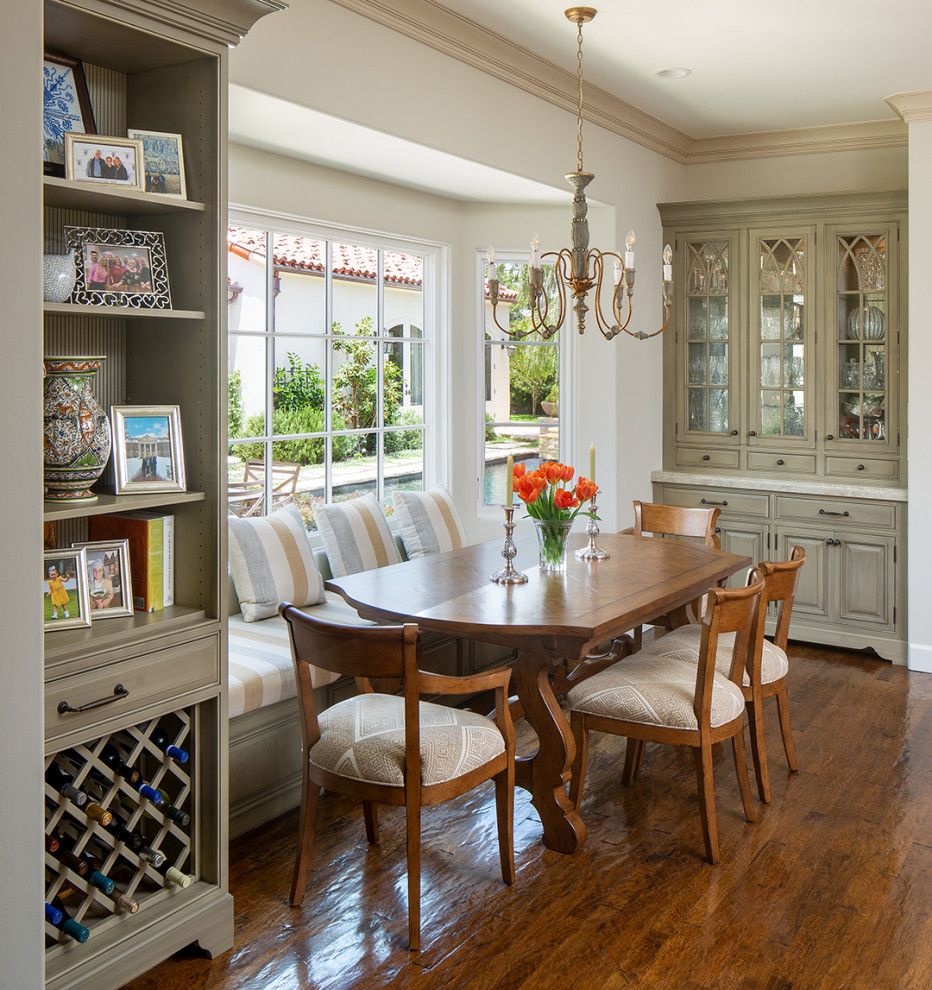 Design ideas for an expansive traditional dining room in San Diego with banquette seating, white walls, medium hardwood flooring and brown floors.