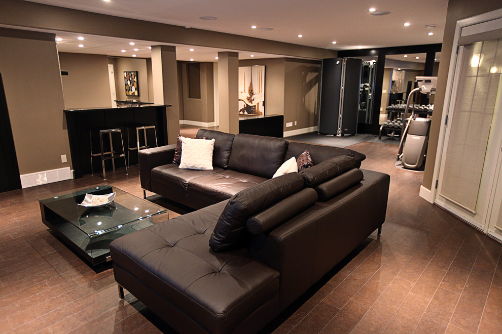 Design ideas for a modern basement in Calgary with brown floor.
