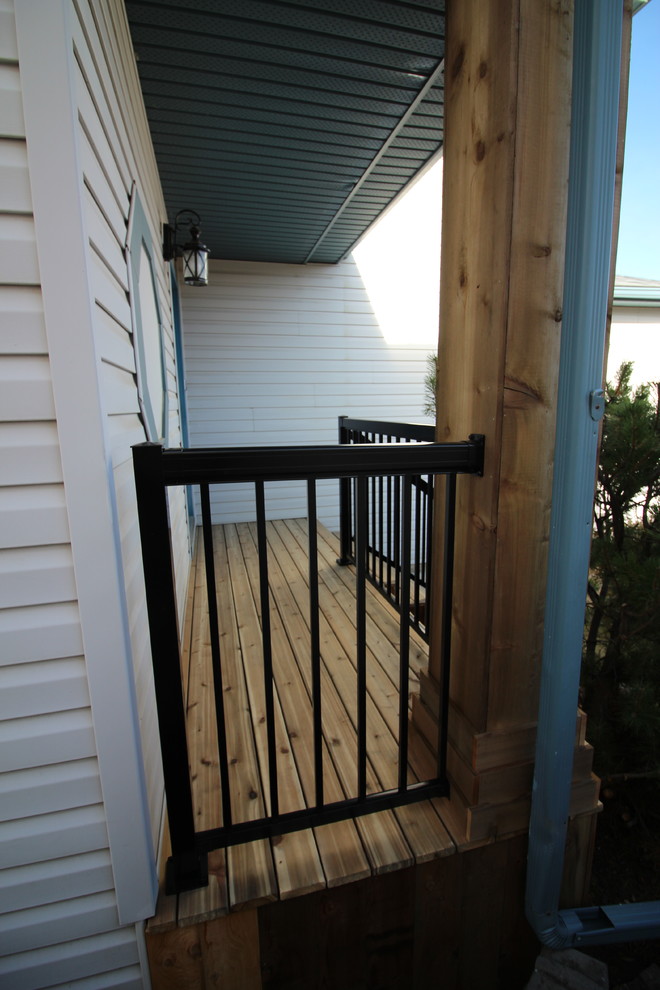 Deck - rustic deck idea in Calgary