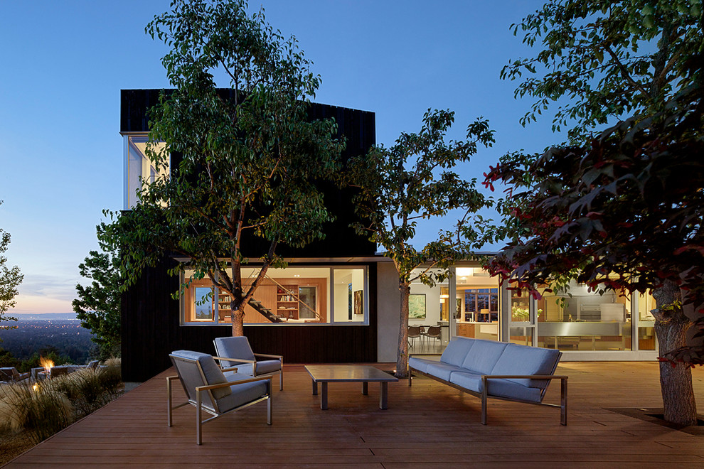 Large contemporary two-storey black exterior in San Francisco with wood siding and a shed roof.