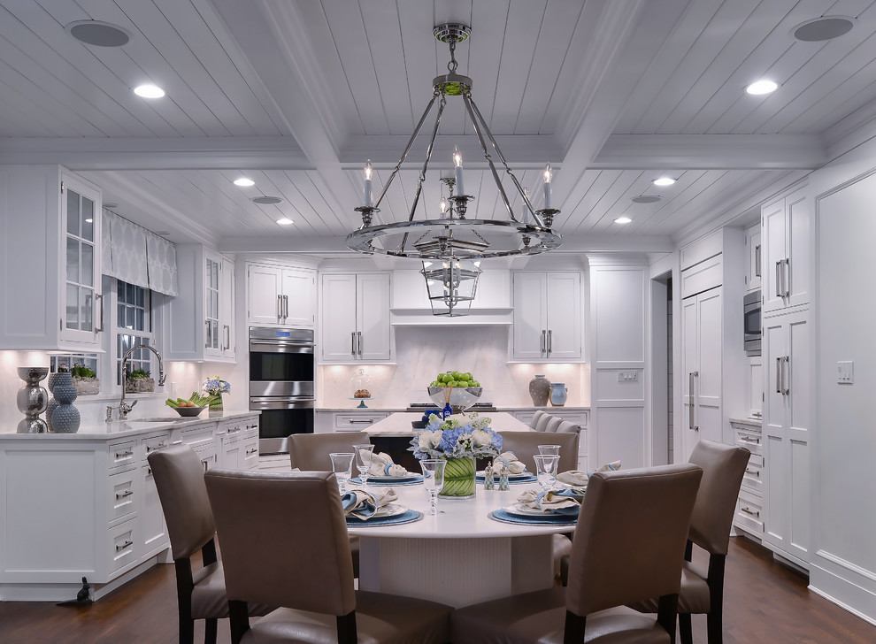 Design ideas for a large transitional eat-in kitchen in New York with white cabinets, marble benchtops, white splashback, stainless steel appliances, dark hardwood floors and with island.