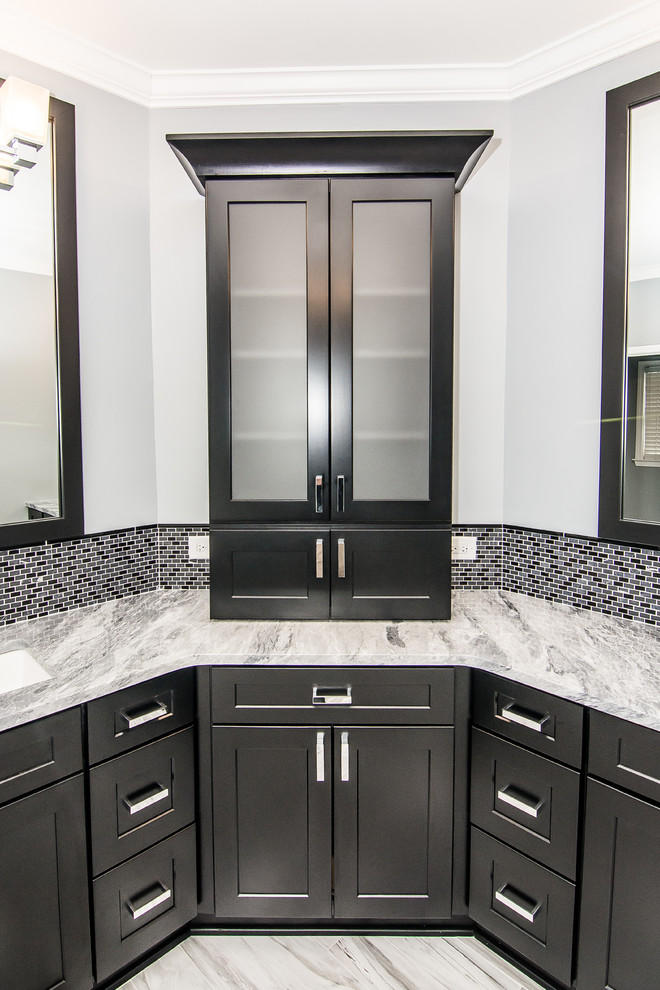 This is an example of a large modern master bathroom in Atlanta with an undermount sink, shaker cabinets, black cabinets, marble benchtops, a drop-in tub, a corner shower, white tile, porcelain tile, grey walls and porcelain floors.