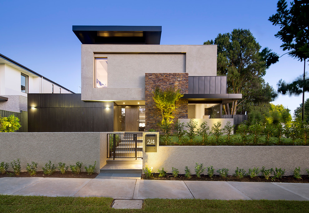 Design ideas for a contemporary two-storey exterior in Melbourne with a flat roof.