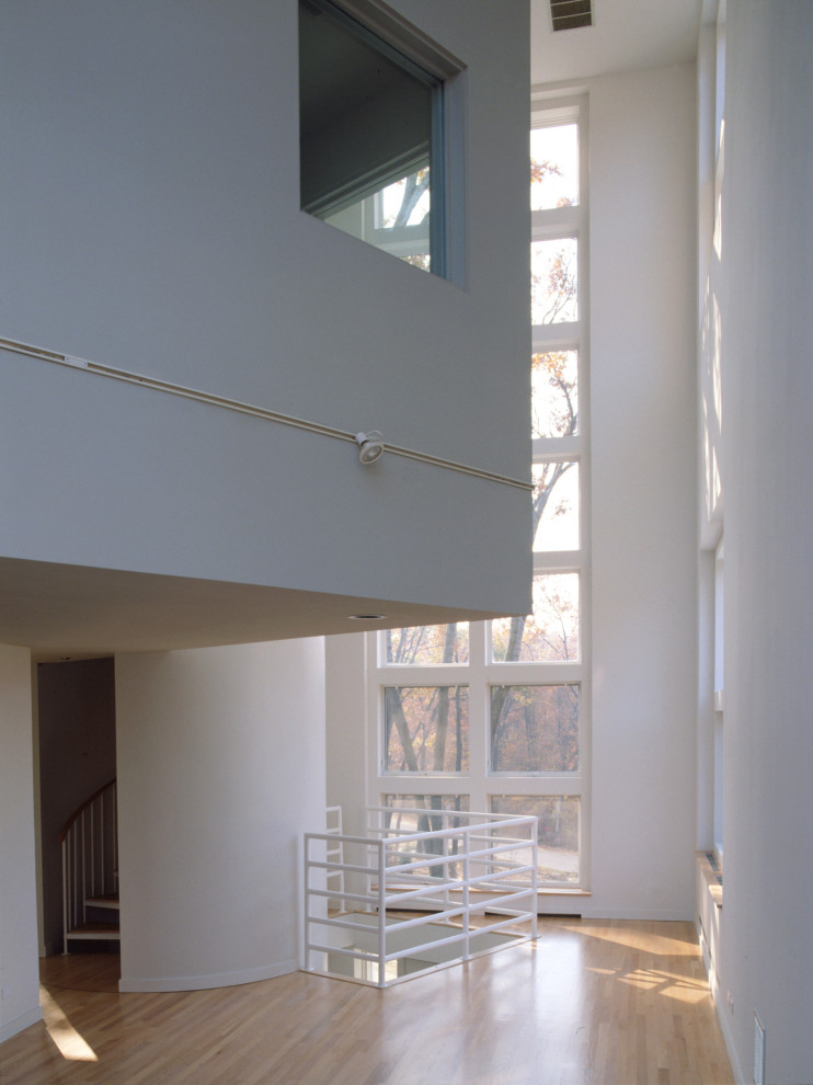 Example of a mid-sized minimalist home design design in Chicago