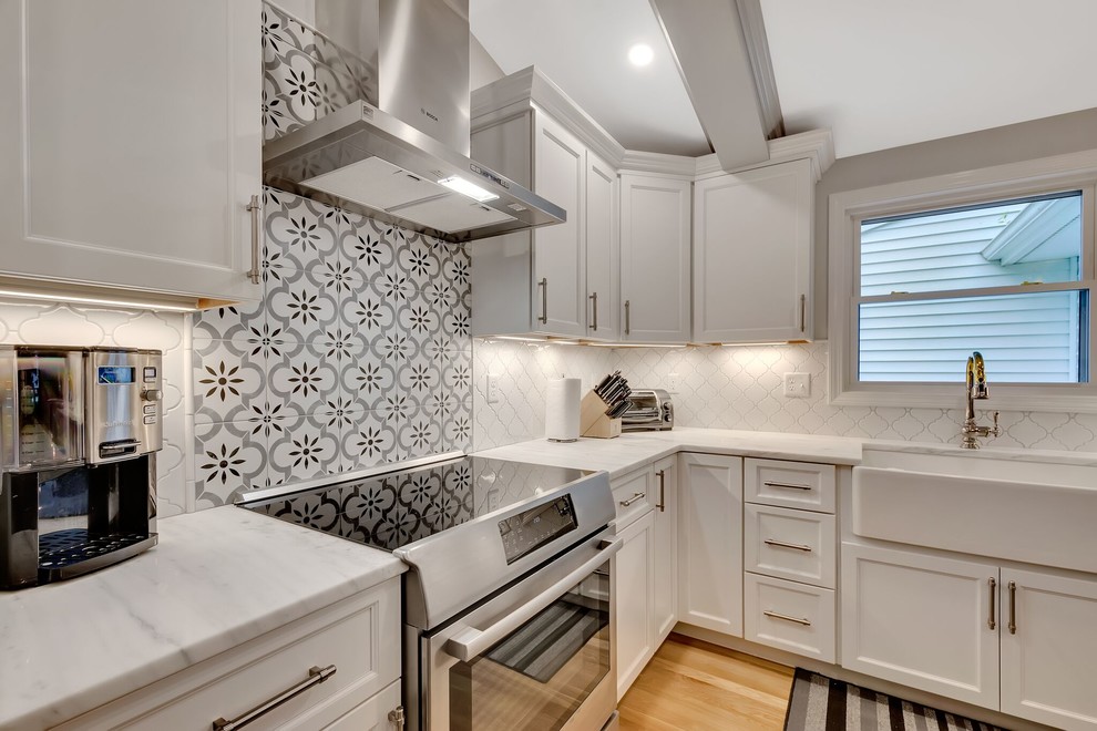 Eat-in kitchen - transitional light wood floor eat-in kitchen idea in Boston with an island
