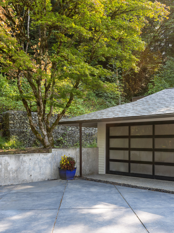 Garage - large coastal attached two-car garage idea in Seattle