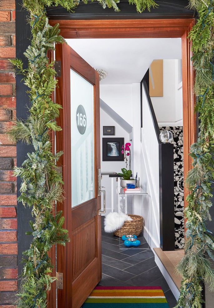 Front door - mid-sized transitional slate floor front door idea in Toronto with white walls and a medium wood front door