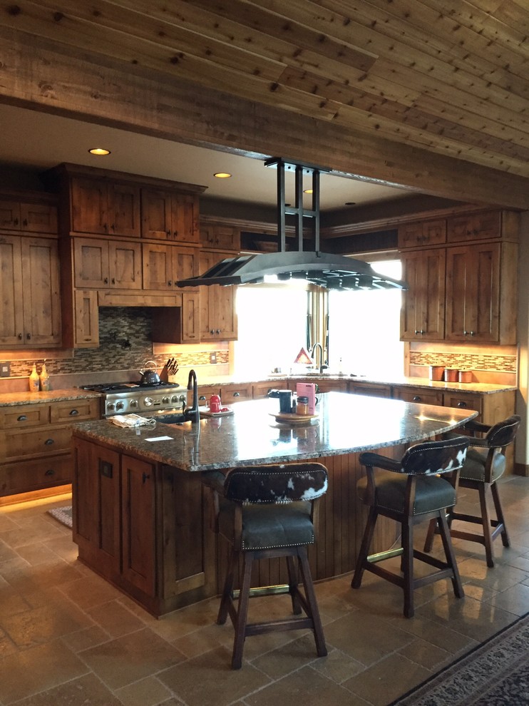 Mid-sized mountain style porcelain tile and beige floor kitchen photo with an undermount sink, recessed-panel cabinets, light wood cabinets, granite countertops, beige backsplash, matchstick tile backsplash, paneled appliances and an island