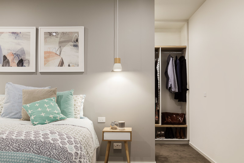 Design ideas for a scandinavian master bedroom in Melbourne with grey walls, carpet, no fireplace and brown floor.