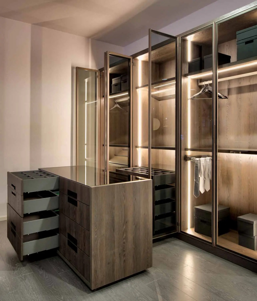 Design ideas for a small contemporary standard wardrobe in London with glass-front cabinets, brown cabinets, brown floors and feature lighting.