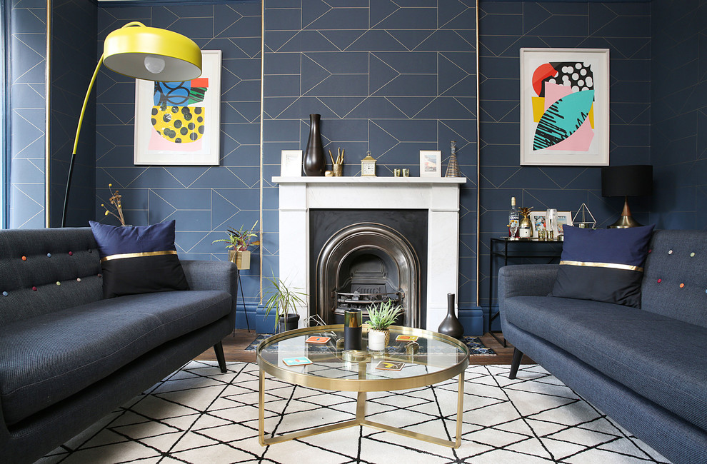 Design ideas for a contemporary formal living room in London with blue walls and a standard fireplace.