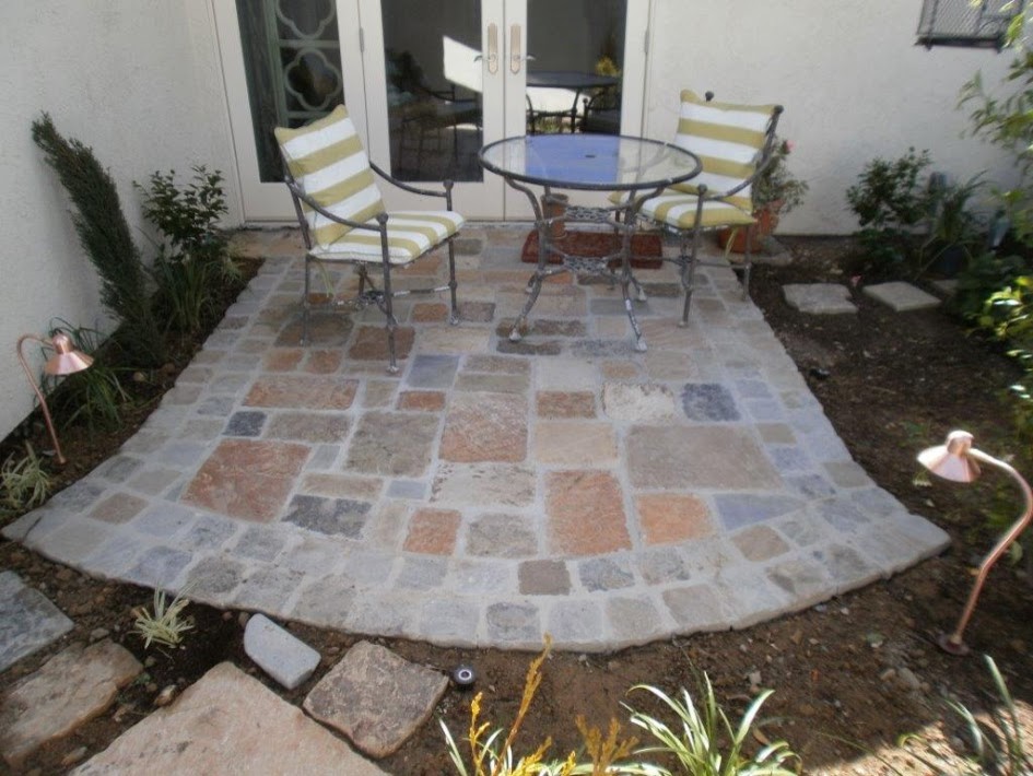 Photo of a small traditional backyard patio in Orange County with natural stone pavers.