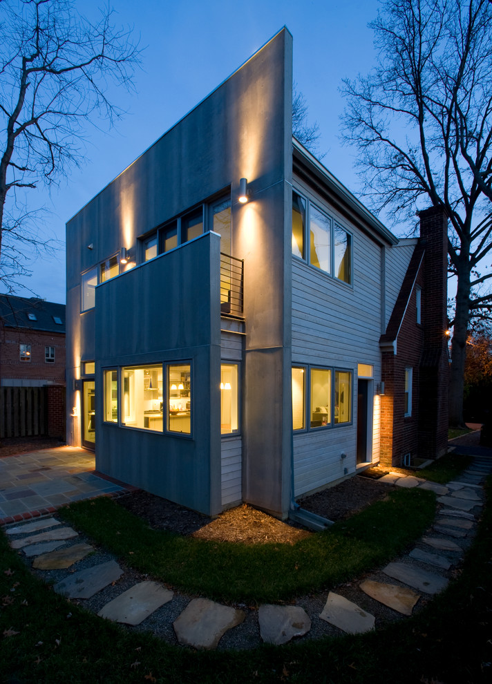 Photo of a modern two-storey grey exterior in DC Metro with mixed siding and a flat roof.
