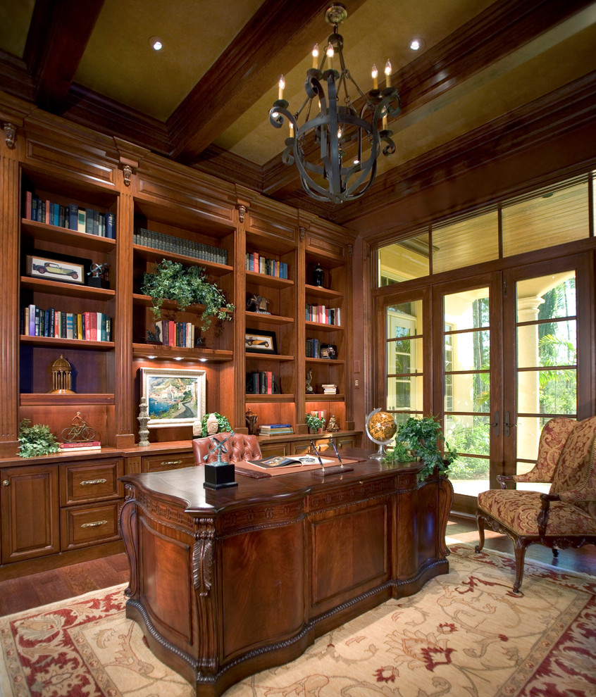 Inspiration for a traditional home office in Miami with dark hardwood floors and a freestanding desk.