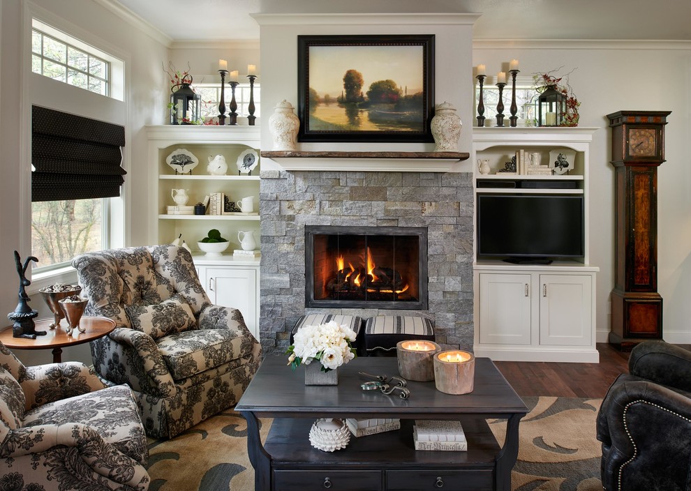 Design ideas for a traditional living room in Denver with grey walls, dark hardwood floors, a standard fireplace and a built-in media wall.