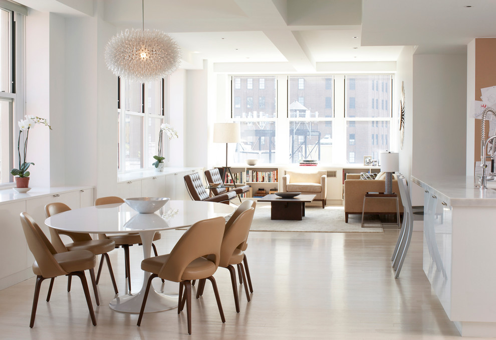 Inspiration for a contemporary open plan dining in New York with white walls and medium hardwood floors.
