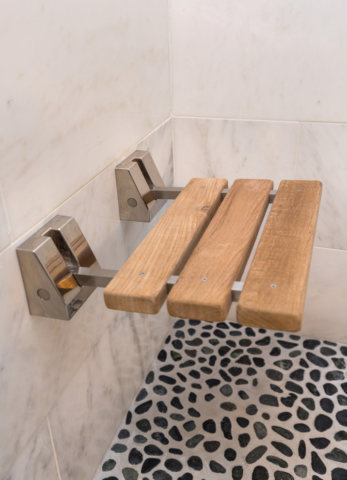 Mid-sized transitional master gray tile and mosaic tile marble floor home design photo with an undermount sink, recessed-panel cabinets, dark wood cabinets, quartzite countertops, a one-piece toilet and gray walls