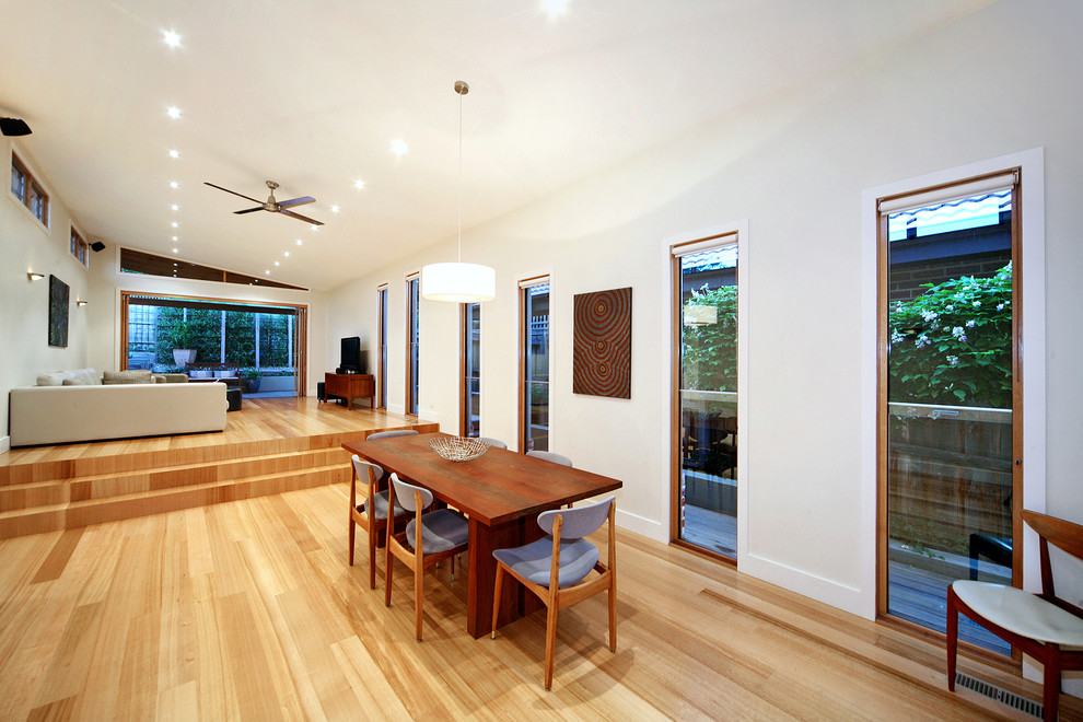 Photo of a contemporary open plan dining in Melbourne.