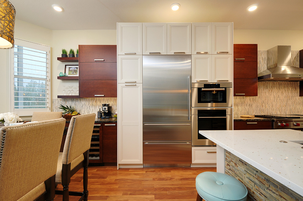 Large transitional l-shaped dark wood floor open concept kitchen photo in Tampa with a farmhouse sink, gray backsplash, matchstick tile backsplash, stainless steel appliances and an island