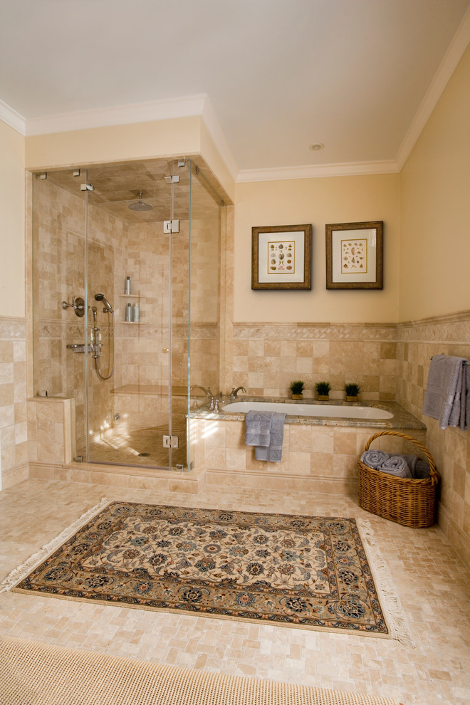 Design ideas for a large traditional master bathroom in Boston with a vessel sink, marble benchtops, an undermount tub, a corner shower, a two-piece toilet, beige tile, stone tile, beige walls and travertine floors.