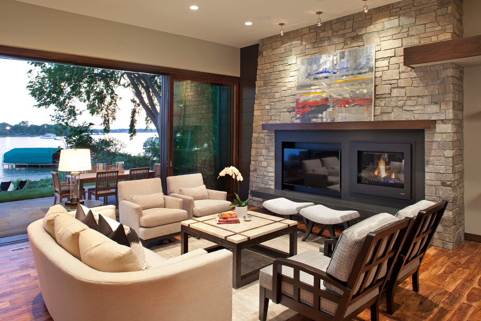 Contemporary living room in Minneapolis with a standard fireplace.