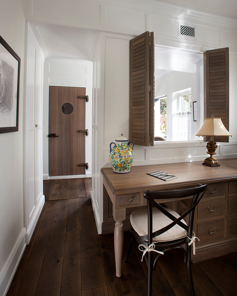 Design ideas for a traditional study room in Phoenix with white walls, dark hardwood floors and a freestanding desk.