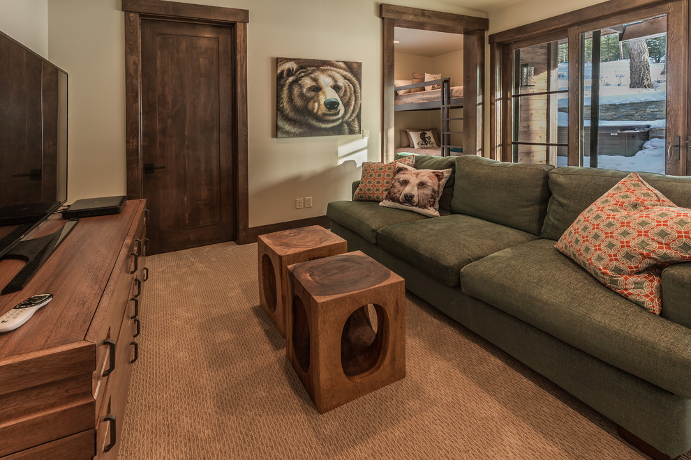 Country family room in Sacramento with beige walls, carpet, a freestanding tv and brown floor.