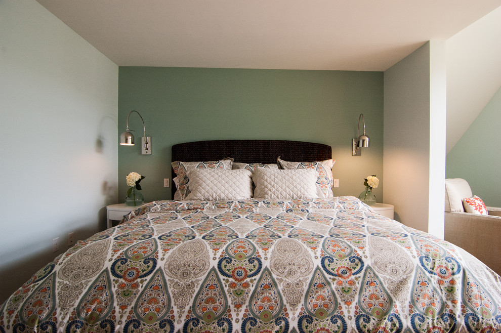 This is an example of a mid-sized beach style master bedroom in Portland Maine with blue walls and blue floor.