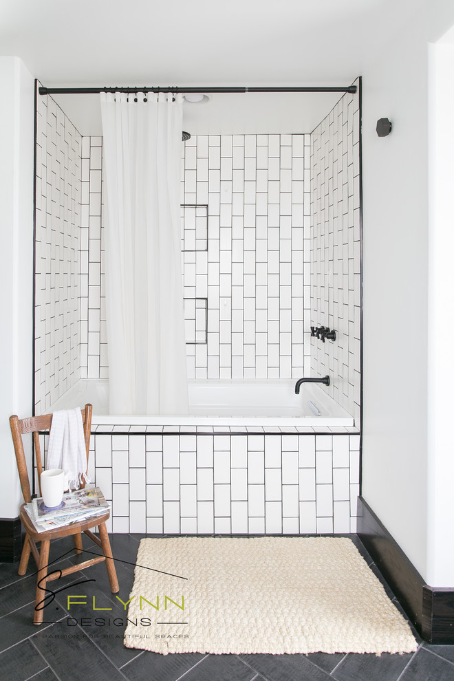 Inspiration for a mid-sized country master bathroom in Cleveland with furniture-like cabinets, light wood cabinets, a drop-in tub, a shower/bathtub combo, black and white tile, subway tile, white walls, mosaic tile floors, a vessel sink and laminate benchtops.