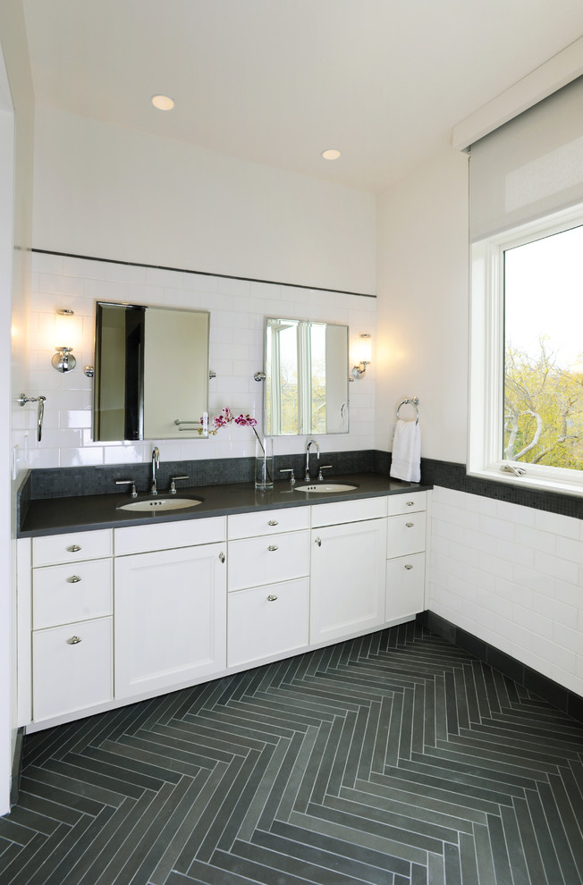 Photo of a large traditional master bathroom in San Francisco with recessed-panel cabinets, white cabinets, white tile, subway tile, white walls, slate floors, an undermount sink, engineered quartz benchtops and grey floor.