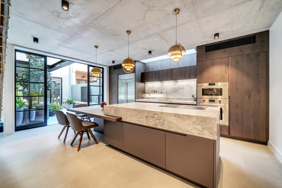 Photo of a large contemporary galley eat-in kitchen in Sydney with an undermount sink, flat-panel cabinets, medium wood cabinets, marble benchtops, grey splashback, stone slab splashback, stainless steel appliances, ceramic floors, with island, grey floor and grey benchtop.