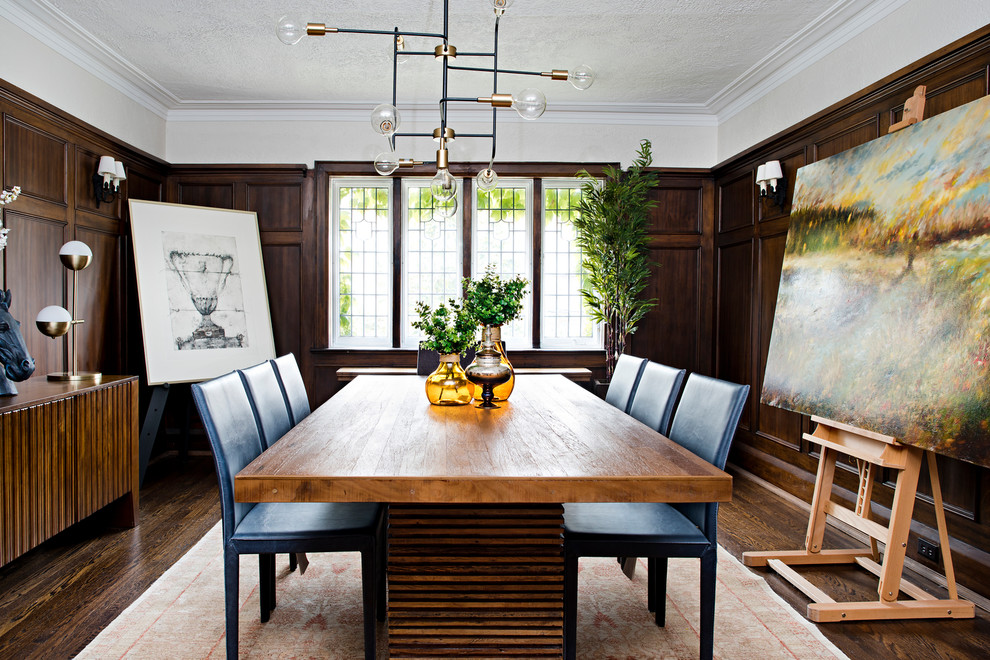 Example of a transitional dark wood floor and brown floor enclosed dining room design in Toronto with brown walls
