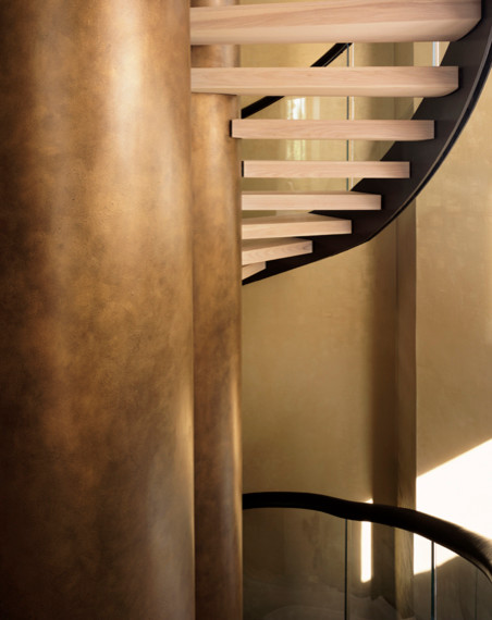 Example of a mid-sized minimalist wooden curved staircase design in London with glass risers