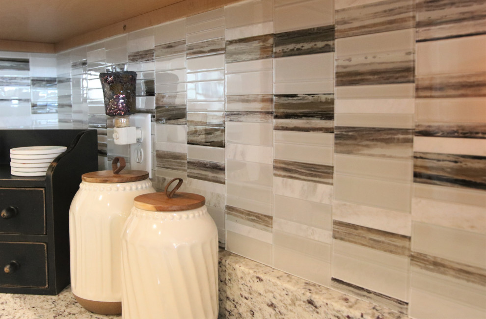 Example of a small eat-in kitchen design with granite countertops, multicolored backsplash, mosaic tile backsplash and multicolored countertops