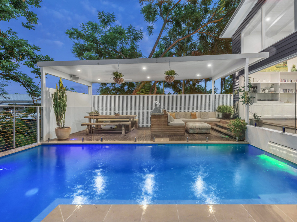 This is an example of a victorian backyard rectangular aboveground pool in Sunshine Coast.