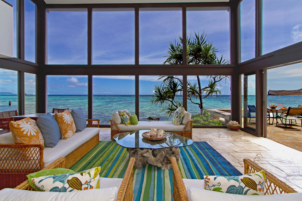 Inspiration for a large beach style formal open concept living room in Hawaii with beige floor and no tv.