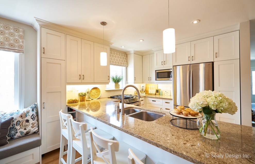 Example of a transitional kitchen design in Toronto