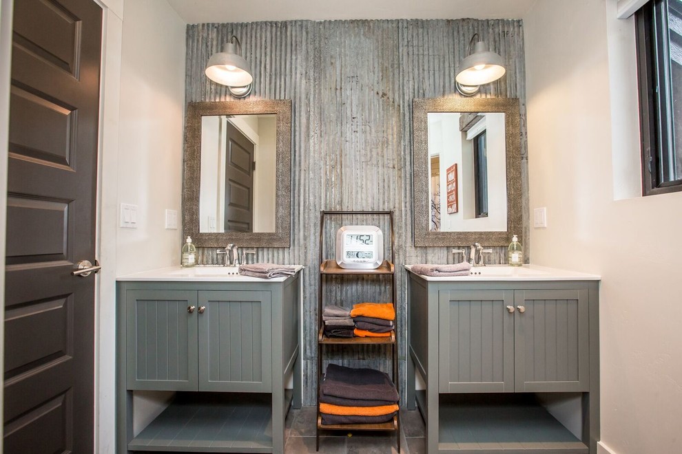 This is an example of a mid-sized industrial master bathroom in Other with shaker cabinets, grey cabinets, gray tile, metal tile, white walls, ceramic floors, an integrated sink and brown floor.