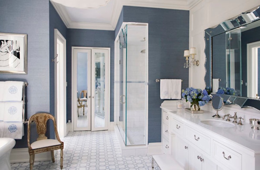 This is an example of a traditional bathroom in Dallas with raised-panel cabinets, white cabinets, a freestanding tub, a corner shower, blue tile, mosaic tile floors, an undermount sink, quartzite benchtops, blue floor and a hinged shower door.