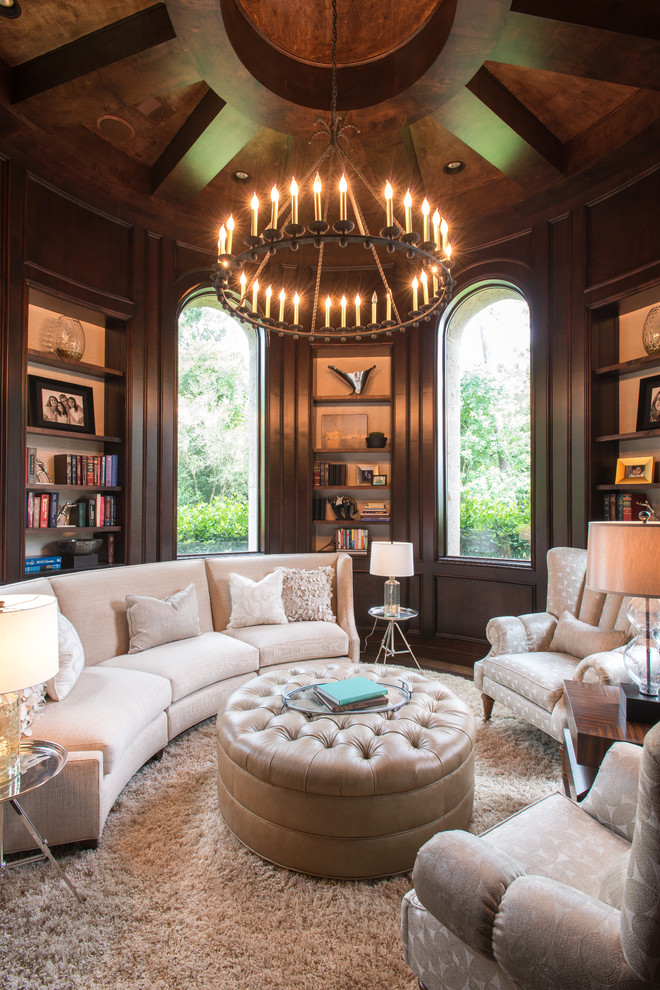 Mediterranean home office in Houston with a library, brown walls, wood and wood walls.
