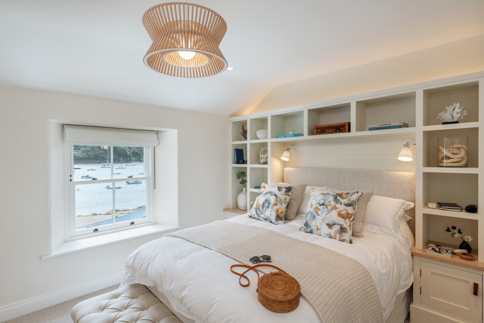 Inspiration for a nautical bedroom in Devon with beige walls, carpet and grey floors.